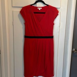 Super cute reddish orange dress. Great for work or a night out on the town.
